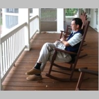 House_view4_WarrenRelaxesOnPorch.JPG